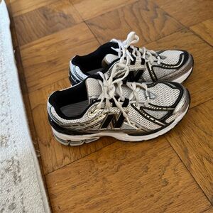 New Balance Black and White Sneakers with Breathable Mesh